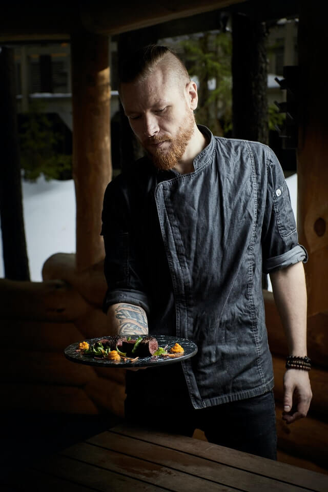 chef-2 A Chef holding out a bowl of food