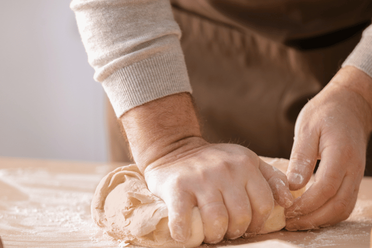 Man Kneading Dough