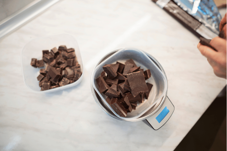 Measuring chocolate on a kitchen scale