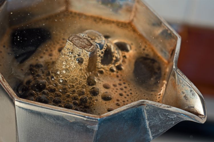 Close up of coffee emerging from mocha